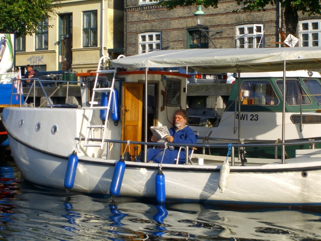 Man reading on his
house boat